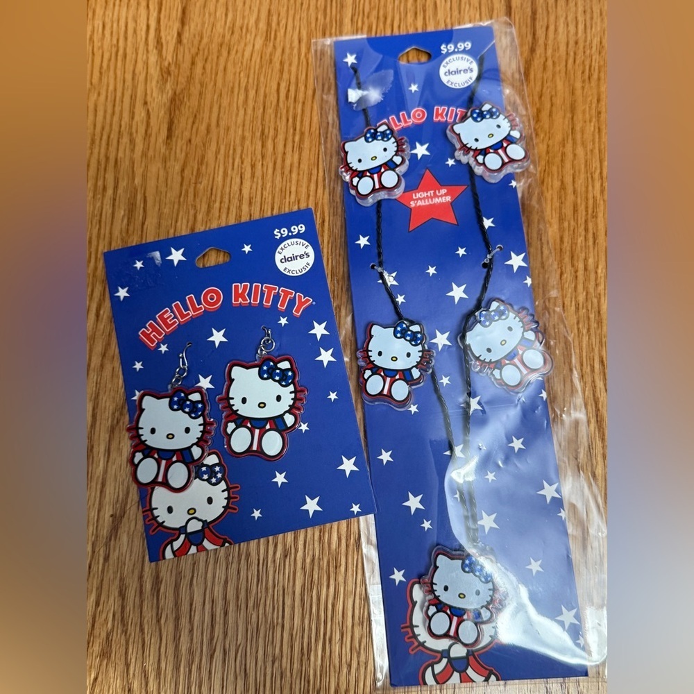 Claire's Hello Kitty Red White Blue Earrings and Light up Necklace set  NEW